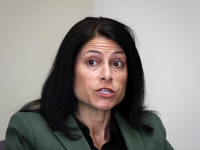 FILE - In this June 4, 2019, file photo, Michigan Attorney General Dana Nessel listens to a question from reporters in Detroit. On Tuesday, Oct. 27, 2020, a judge blocked a sudden ban on the open display of guns near Michigan polling places on Election Day. Gun-rights groups said Secretary …