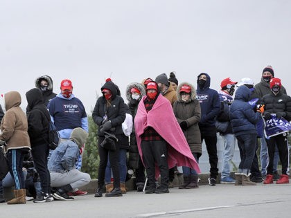 Supporters of President Donald Trump wait in line prior to a campaign rally at the Wilkes Barre/Scranton International Airport, Monday, Nov. 2, 2020, in Wilkes Barre, Pa. (AP Photo/Michael Perez)