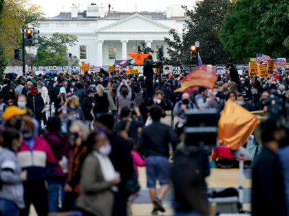 Demonstrators gather outside the White House, Tuesday, Nov. 3, 2020, in Washington. (AP Photo/Jacquelyn Martin)