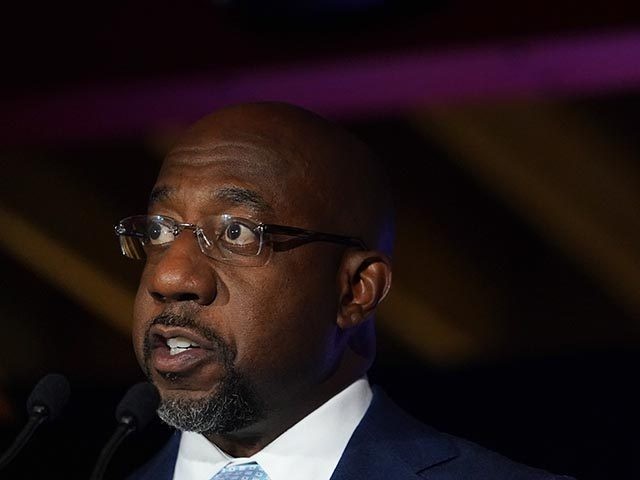 Raphael Warnock, a Democratic candidate for the U.S. Senate speaks during a rally, Tuesday, Nov. 3, 2020, in Atlanta. (AP Photo/Brynn Anderson, Pool)