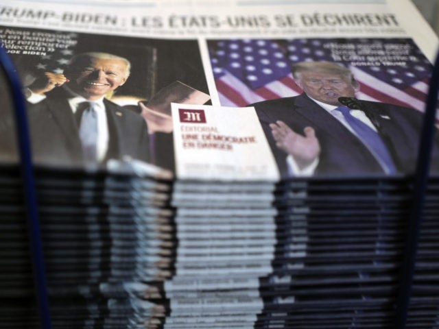 A pile of French newspaper Le Monde headlines "Trump-Biden : the United States is tearing itself apart, Editorial : a democracy in danger" about the U.S. presidential elections, at a newspapers stand in Paris, Wednesday, Nov. 4, 2020. The world is watching as millions of Americans cast their ballots for …