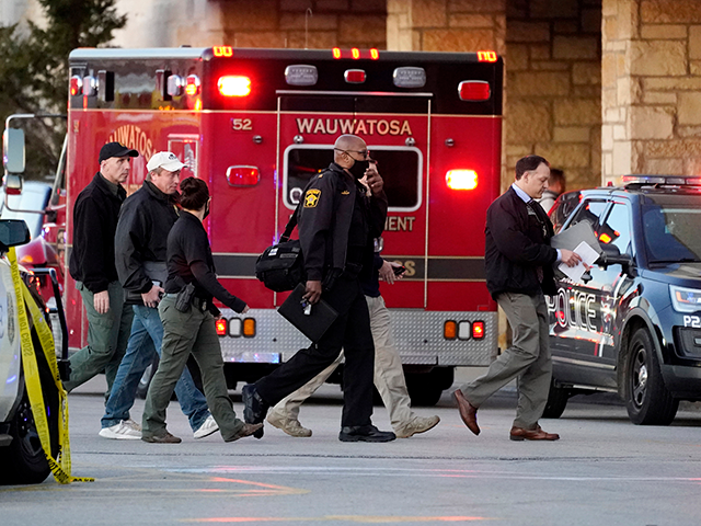 Police officials walk to the Mayfair Mall, Friday, Nov. 20, 2020, in Wauwatosa, Wis. Multiple people were shot Friday afternoon at the mall and police are still searching for the shooter. (AP Photo/Nam Y. Huh)