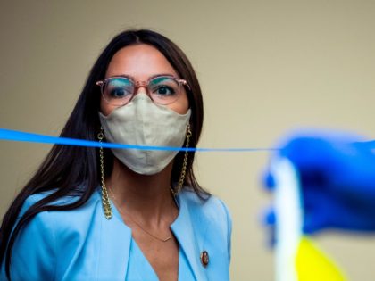 Rep. Alexandria Ocasio-Cortez, D-N.Y., arrives as Postmaster General Louis DeJoy testifies