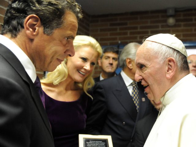 Andrew Cuomo and Pope Francis (NEW YORK, NY - SEPTEMBER 25: New York Governor Andrew Cuomo, along with his girlfriend Sandra Lee, give a gift to Pope Francis at Our Lady Queen of Angels School in East Harlem, September 25, 2015 in New York City. Pope Francis is on a …