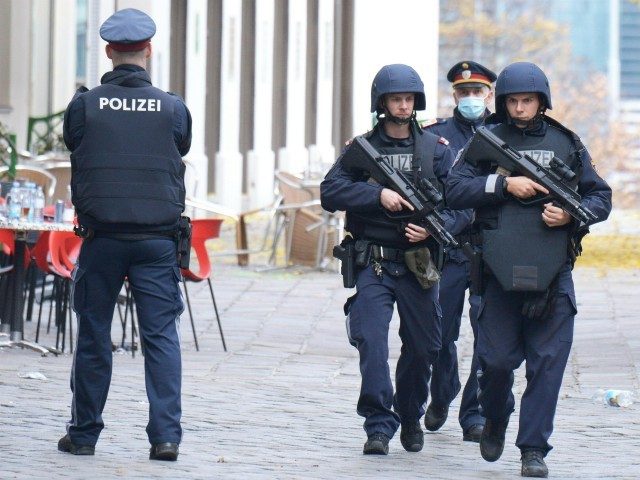 Policemen patrol on November 3, 2020 close to a crime scene in Vienna after a shooting. - A huge manhunt was under way Tuesday, November 3, 2020 after gunmen opened fire on November 2, 2020 at multiple locations across central Vienna, killing at least four people in what Austrian Chancellor …