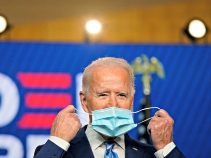 WILMINGTON, DE - NOVEMBER 04: Democratic presidential nominee Joe Biden takes his face mas
