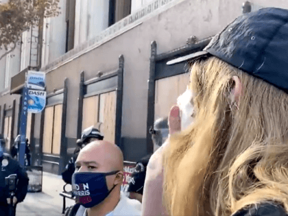 Woman screams Blue Lives Do Not Matter at LAPD officers during a Biden-Harris rally on Saturday. (Twitter Video Screenshot/Tomas Morales)