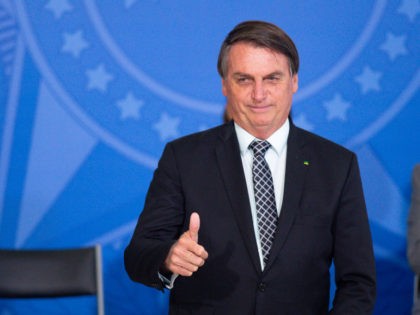 BRASILIA, BRAZIL - OCTOBER 28: Jair Bolsonaro, President of Brazil, gestures during Civil Servant Day Ceremony amidst the coronavirus (COVID-19) pandemic at the Planalto Palace on October 28, 2020 in Brasilia. Brazil has over 5.439,000 confirmed positive cases of Coronavirus and more than 157,000 deaths. (Photo by Andressa Anholete/Getty Images)