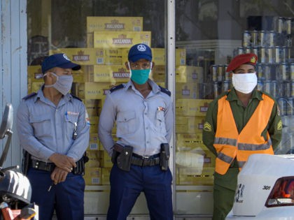Police officers stand guard outside a store selling products in US dollars, in Havana on July 20, 2020 as Cuba eliminated the dollar tax to boost the economy amid the COVID-19 novel coronavirus pandemic. - Cuba eliminated on Monday the 10 percent tax it has previously levied on the use …