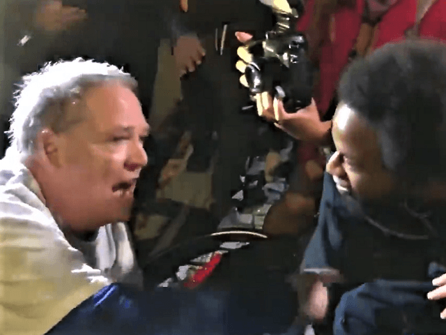 BLM protester attacks an elderly Trump supporter after the Million MAGA March in DC. (Twitter Video Screenshot/Drew Hernandez)
