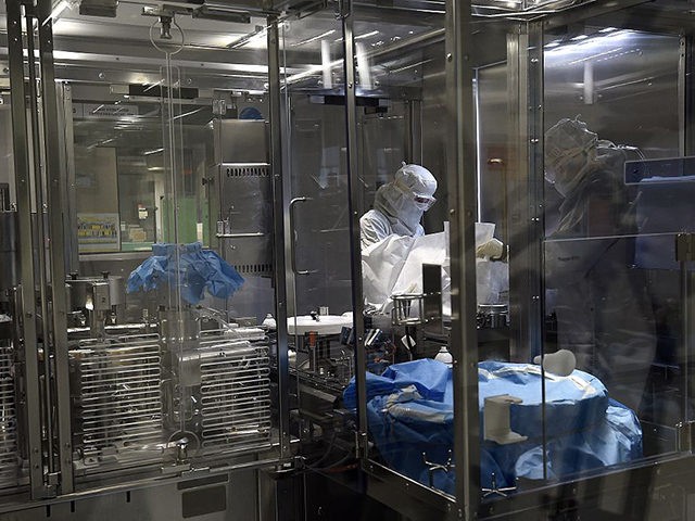 TO GO WITH AFP STORY BY ETIENNE BALMER Employees work in an unit dedicated to the production of insulin pens at the factory of the US pharmaceutical company Eli Lilly in Fegersheim, eastern France, on October 12, 2015. US pharmaceutical company Eli Lilly produces mostly insulin for the international market. …