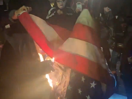 Antifa and BLM protesters burn U.S. flag in Vancouver, Washington, during Halloween-night protest. (Twitter Video Screenshot)