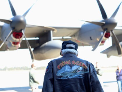 A former 75th Fighter Squadron pilot and World War II veteran walks toward an HC-130J Comb