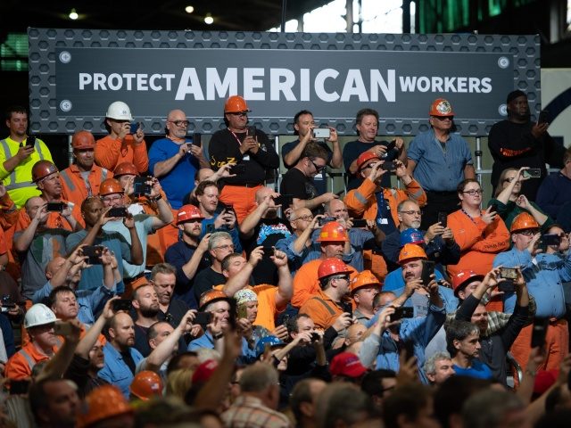 Workers listen as US President Donald Trump speaks about trade at US Steel's Granite City