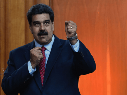 Venezuelan President Nicolas Maduro leaves after offering a press conference in Caracas, on January 25, 2019. - Venezuela's opposition leader Juan Guaido called Friday for a "major demonstration" next week to demand the resignation of President Nicolas Maduro, in his first public appearance since declaring himself "acting president" two days …