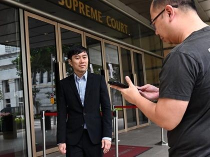 Singaporean activist Jolovan Wham (L) leaves the High Court in Singapore on April 29, 2019 after his sentencing for scandalising the judiciary. (Photo by Roslan RAHMAN / AFP) (Photo credit should read ROSLAN RAHMAN/AFP via Getty Images)