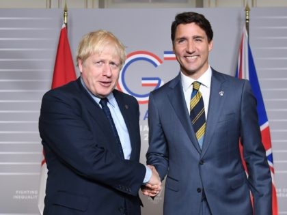 BIARRITZ, FRANCE - AUGUST 24: British Prime Minister Boris Johnson (L) shakes hands with Prime Minister of Canada Justin Trudeau on August 24, 2019 in Biarritz, France. The French southwestern seaside resort of Biarritz is hosting the 45th G7 summit from August 24 to 26. High on the agenda will …