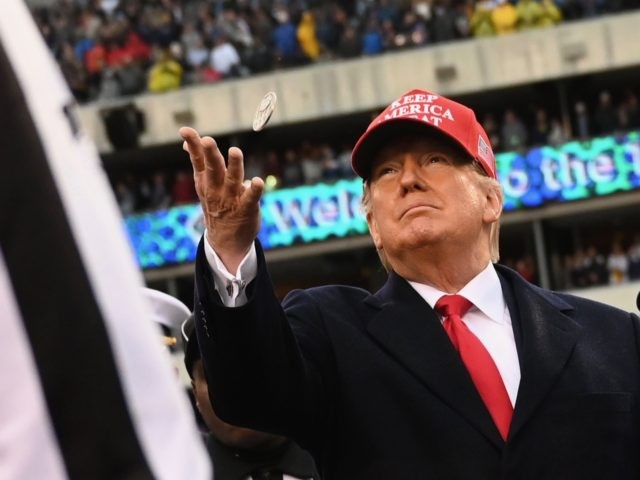 US President Donald Trump tosses the coin before the Army v. Navy American Football game in Philadelphia on December 14, 2019. (Photo by Andrew Caballero-Reynolds / AFP) (Photo by ANDREW CABALLERO-REYNOLDS/AFP via Getty Images)