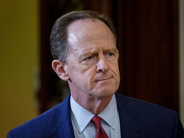 WASHINGTON, DC - JANUARY 30: Sen. Pat Toomey (R-PA) leaves the Senate chamber during a recess in the Senate impeachment trial of U.S. President Donald Trump continues at the U.S. Capitol on January 30, 2020 in Washington, DC. On Thursday, Senators continue asking questions for the House impeachment managers and …