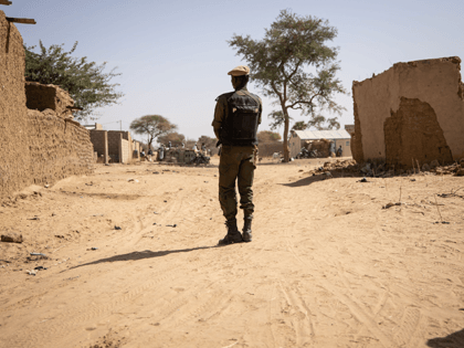 A Burkina Faso soldier patrols at a district welcoming Internally Displaced People (IDP) from northern Burkina Faso in Dori, on February 3, 2020. - 600 000 Internally Displaced People (IDP) have fled recent attacks in northern Burkina Faso. (Photo by OLYMPIA DE MAISMONT / AFP) / The erroneous mention[s] appearing …