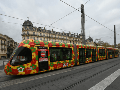 A woman waits for the tram at the Place de la Comedie station in Montpellier, on March 23, 2020, southern France, on the seven day of a strict lockdown in France aimed at curbing the spread of COVID-19 caused by the novel coronavirus. (Photo by Pascal GUYOT / AFP) (Photo …