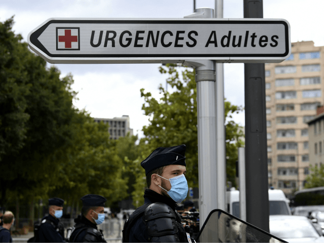 CSR riot police stand under a street sign for the adult emergency room at the entrance of the Timone hospital in Marseille, on September 25, 2020, during a visit by the French Health minister amid the Covid-19 (novel coronavirus) pandemic. (Photo by NICOLAS TUCAT / AFP) (Photo by NICOLAS TUCAT/AFP …