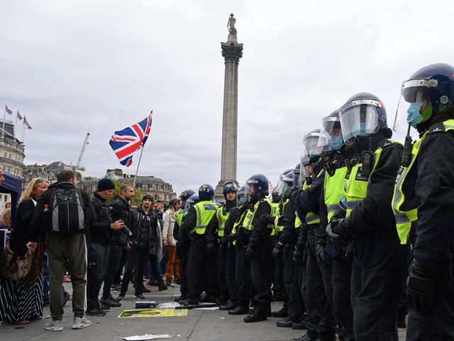 Police move in to disperse protesters in Trafalgar Square in London on September 26, 2020,