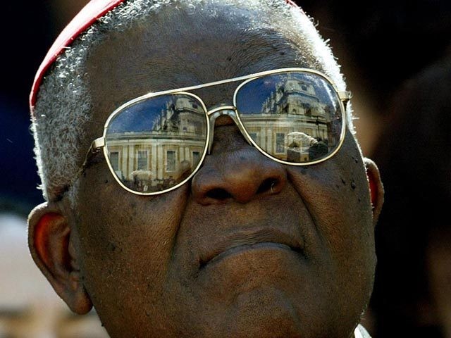 Cardinal Wiyghan Christian Tumi of Cameroon looks at St. Peter's Basilica as he leaves a m