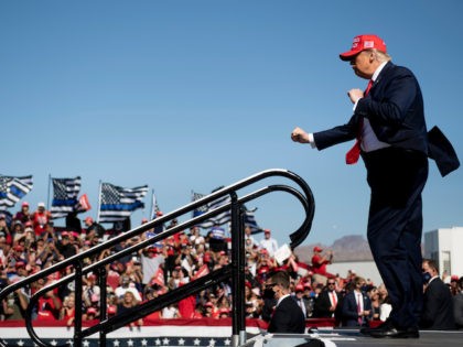 TOPSHOT - US President Donald Trump dances as he leaves after speaking during a Make America Great Again rally at Laughlin/Bullhead International Airport October 28, 2020, in Bullhead City, Arizona. (Photo by Brendan Smialowski / AFP) (Photo by BRENDAN SMIALOWSKI/AFP via Getty Images)