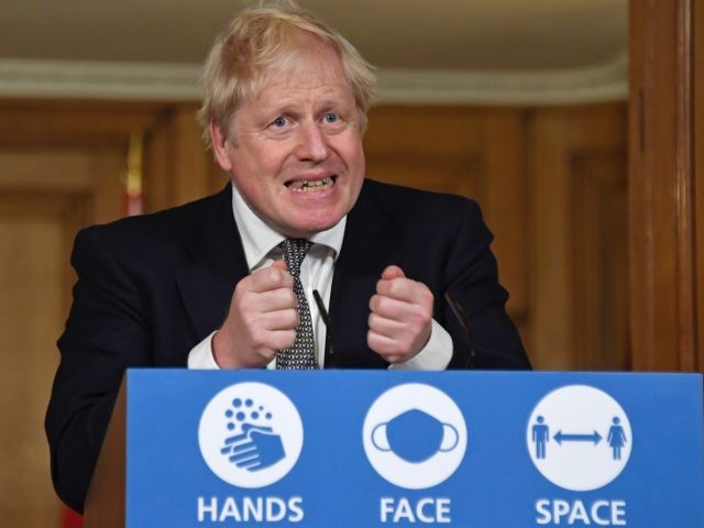 LONDON, UNITED KINGDOM - OCTOBER 31: Britain's Prime Minister Boris Johnson gestures as he speaks during a press conference in 10 Downing Street on October 31, 2020 in London, England. The PM announced a new four week lockdown across England, starting Thursday, to help combat a coronavirus surge. (Photo by …