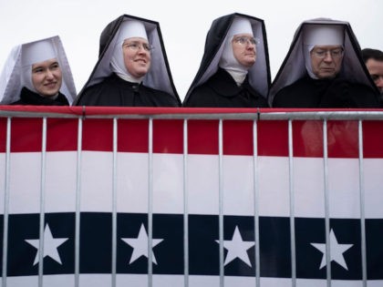 Nuns wait for US President Donald Trump to speak during a "Make America Great Again" rally at Total Sports Park on November 1, 2020, in Washington, Michigan. (Photo by Brendan Smialowski / AFP) (Photo by BRENDAN SMIALOWSKI/AFP via Getty Images)