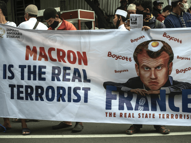 Muslims protesters attend a protest against French President Emmanuel Macron in Surabaya o