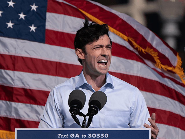 Democratic US Senate candidate Jon Ossoff speaks at a Get Out the Vote rally with former US President Barack Obama as he campaigns for Democratic presidential candidate former Vice President Joe Biden on November 2, 2020, in Atlanta, Georgia. (Photo by Elijah Nouvelage / AFP) (Photo by ELIJAH NOUVELAGE/AFP via …