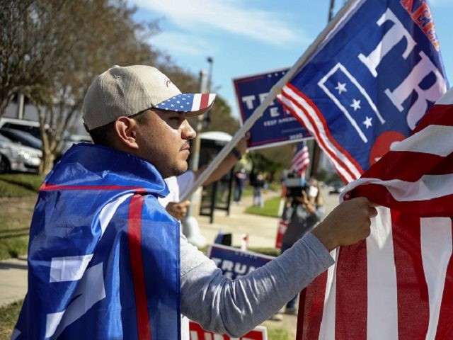 HOUSTON, TX - NOVEMBER 03: A President Donald Trump supporter during a rally on West Gray Street on November 3, 2020 in Houston, Texas. After a record-breaking early voting turnout, Americans head to the polls on the last day to cast their vote for incumbent U.S. President Donald Trump or …