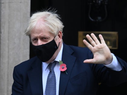 Britain's Prime Minister Boris Johnson, wearing a face mask, leaves number 10 Downing