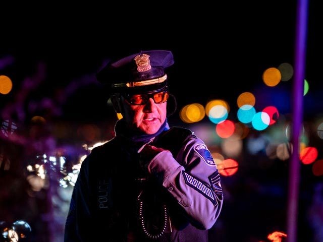 MINNEAPOLIS, MN - NOVEMBER 04: A member of the Minneapolis Police Department speaks into h