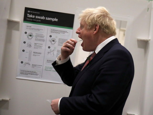 LEICESTER, ENGLAND - NOVEMBER 06: British Prime Minister Boris Johnson takes a coronavirus