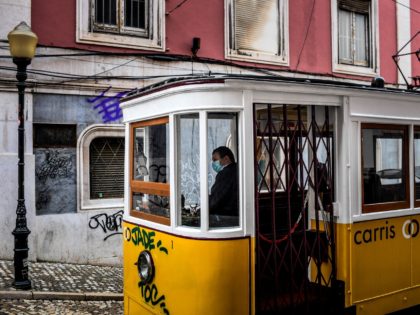 A tram driver waits for passengers at Gloria Tram in downtown Lisbon on November 7, 2020.