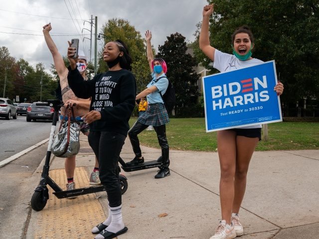 ATLANTA, GA - NOVEMBER 07: People celebrate Joe Biden’s projected presidential win at Fr