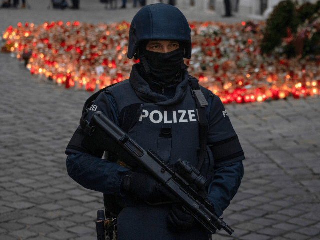 An armed police officer stands guard before the arrival of Austrian Chancellor Kurz and President of the European Council to pay respects to the victims of the recent terrorist attack in Vienna, Austria on November 9,2020. (Photo by JOE KLAMAR / AFP) (Photo by JOE KLAMAR/AFP via Getty Images)