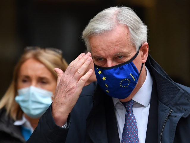 EU chief negotiator Michel Barnier wearing a face mask because of the novel coronavirus pandemic walks to a conference centre to continue negotiations on a trade deal between the EU and the UK in London on November 11, 2020. - The European Union and Britain said major divergences remain but …