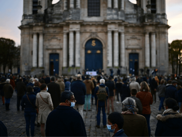 Catholic faitfuls take part in a rally to protest against COVID-19 restrictions under which masses are banned in churches, on November 15, 2020 in Versailles, outside Paris, as France is on a second lockdown to tackle the spread of the Covid-19 pandemic caused by the novel coronavirus. (Photo by MARTIN …