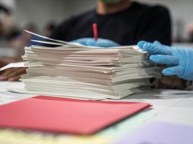 LAWRENCEVILLE, GA - NOVEMBER 16: Gwinnett County election workers handle ballots as part o