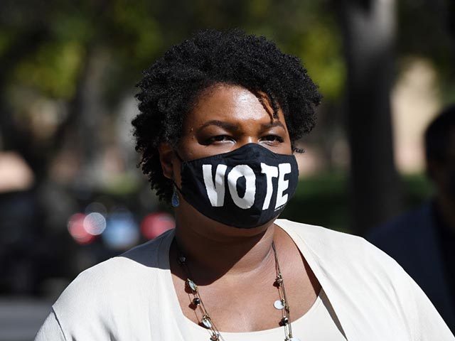LAS VEGAS, NEVADA - OCTOBER 24: Former Georgia gubernatorial candidate Stacey Abrams waits to speak at a Democratic canvass kickoff as she campaigns for Joe Biden and Kamala Harris at Bruce Trent Park on October 24, 2020 in Las Vegas, Nevada. In-person early voting for the general election in the …