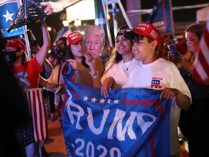 MIAMI, FLORIDA- NOVEMBER 03: Supporters of President Donald Trump cheer for him outside of the Versailles restaurant as they await results of the presidential election on November 03, 2020 in Miami, Florida. After a record-breaking early voting turnout, Americans head to the polls on the last day to cast their …