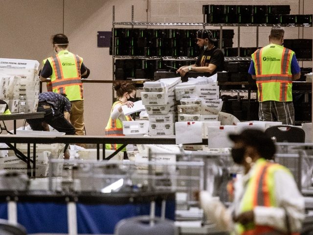 Election workers count ballots at the Philadelphia Convention Center on November 06, 2020