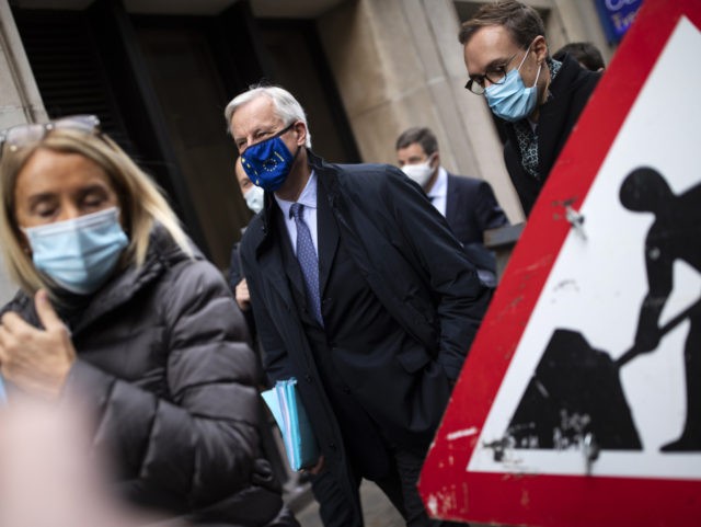LONDON, ENGLAND - NOVEMBER 09: EU Chief negotiator Michel Barnier walks with members of th