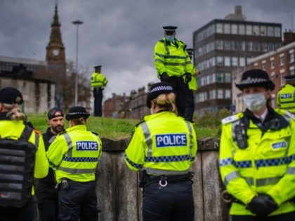 LIVERPOOL, ENGLAND - NOVEMBER 14: Paul Boys is detained and arrested by Police officers during an anti lockdown protest on November 14, 2020 in Liverpool, England. Throughout the Covid-19 pandemic, there have been recurring protests across England against lockdown restrictions and other rules meant to curb the spread of the …