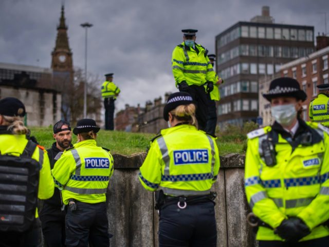 LIVERPOOL, ENGLAND - NOVEMBER 14: Paul Boys is detained and arrested by Police officers du