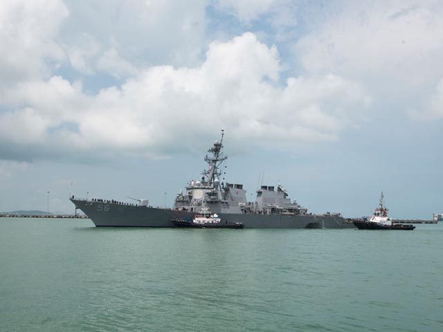 CHANGI NAVAL BASE, SINGAPORE: In this released U.S. Navy handout, tugboats from Singapore